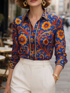 Women's blue floral button blouse with pointed collar and long sleeves