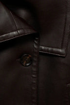 Women's cropped wrap jacket with long sleeves, wide collar and tie belt