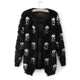 Women's black cardigan with repeated white skull and crossbones pattern