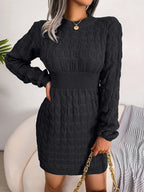 Women's cable knit sweater mini dress with crew neckline and long sleeves