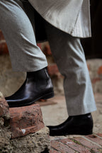 Black Chelsea boot with elastic side panel and low heel