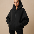 Women's oversized hooded zip-up sweatshirt with front pockets and long sleeves