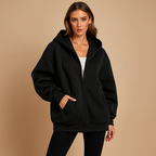 Women's oversized hooded zip-up sweatshirt with front pockets and long sleeves
