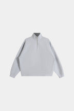 Gray cropped quarter-zip hoodie with mock neck and long sleeves