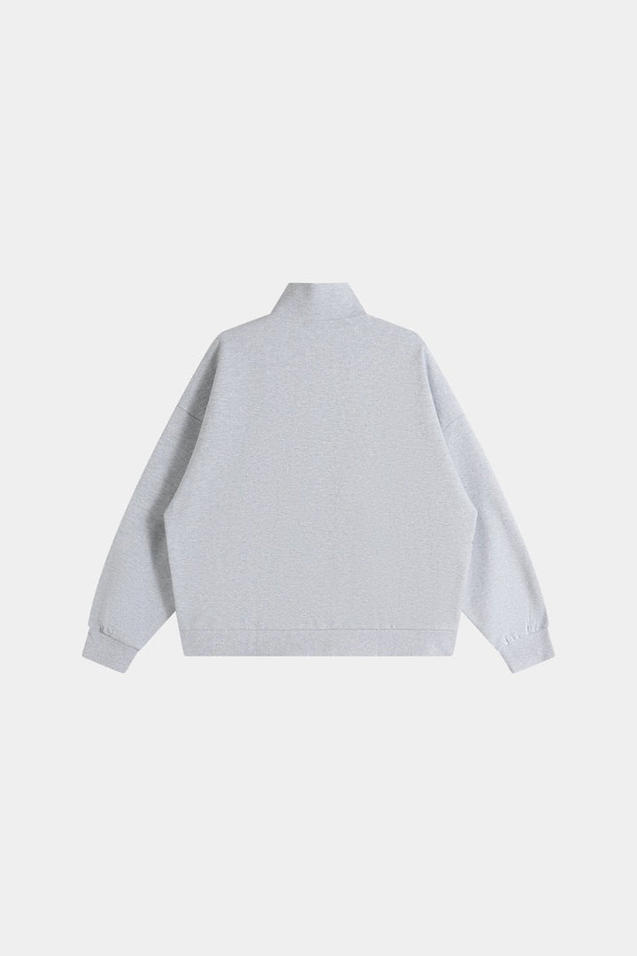 Gray cropped quarter-zip hoodie with mock neck and long sleeves