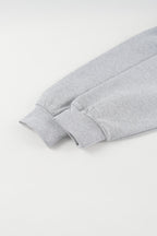 Gray cropped quarter-zip hoodie with mock neck and long sleeves