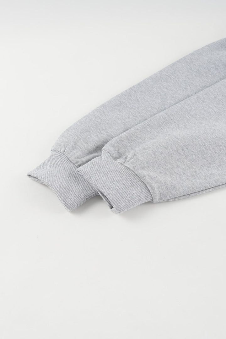 Gray cropped quarter-zip hoodie with mock neck and long sleeves