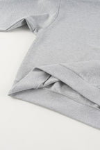 Gray cropped quarter-zip hoodie with mock neck and long sleeves