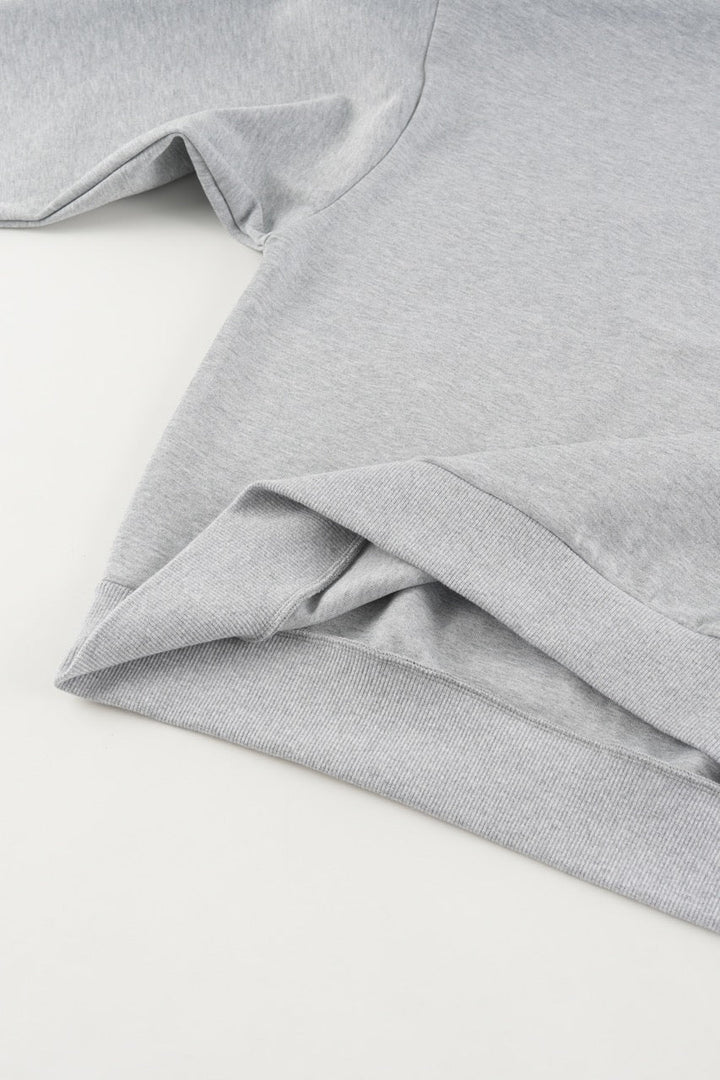 Gray cropped quarter-zip hoodie with mock neck and long sleeves