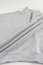 Gray cropped quarter-zip hoodie with mock neck and long sleeves