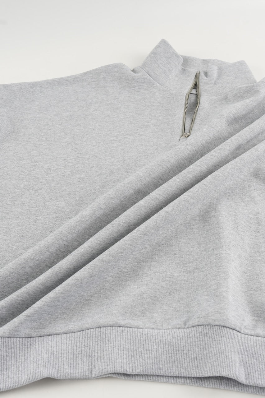 Gray cropped quarter-zip hoodie with mock neck and long sleeves