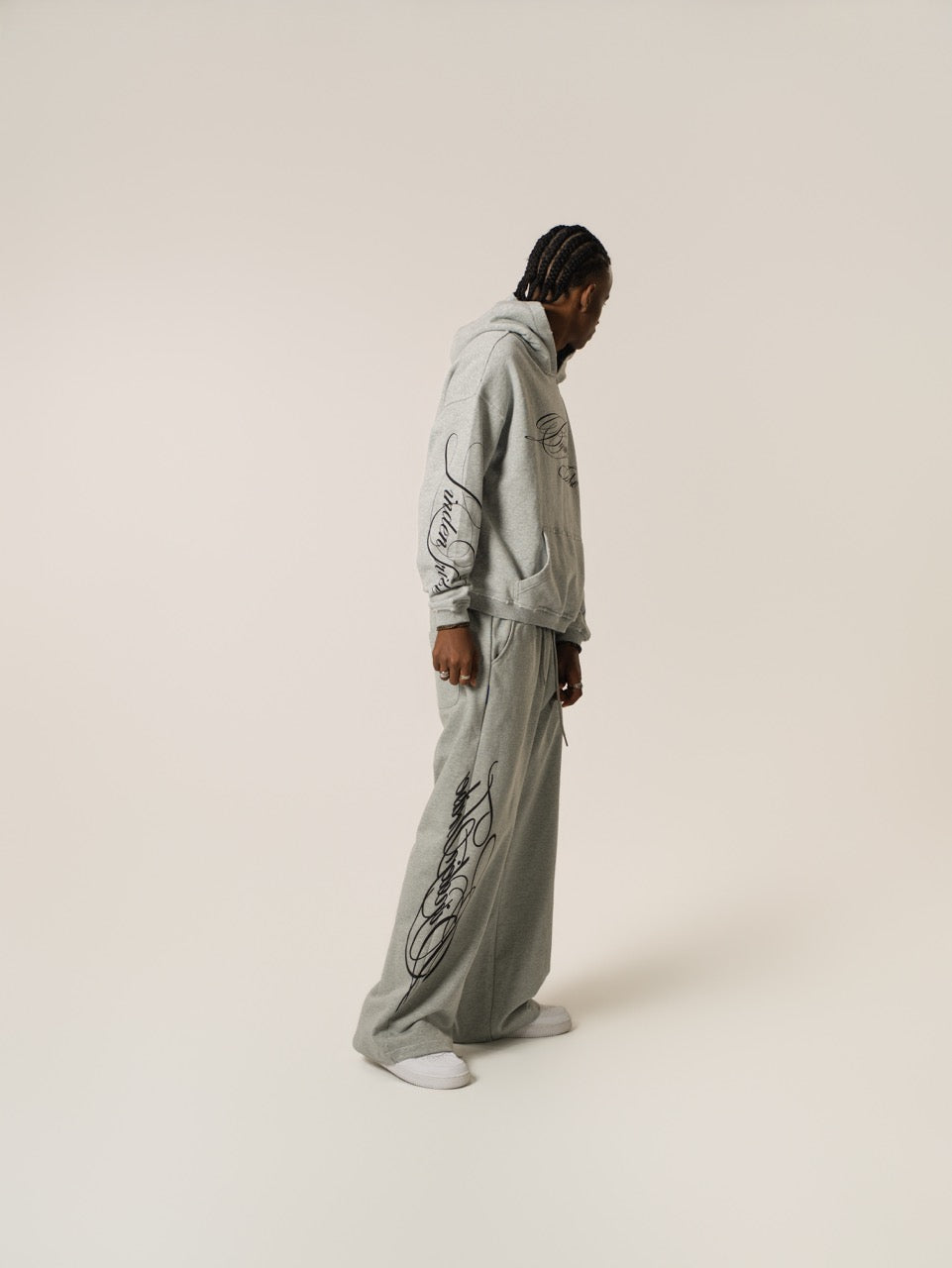 Men's grey hoodie with black script graphic, hood and kangaroo pocket