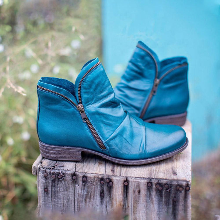 Women's ankle boots with ruched panels, side zips and low heels
