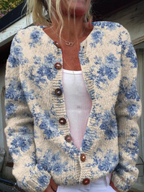 Women's beige cardigan with blue floral pattern and brown buttons