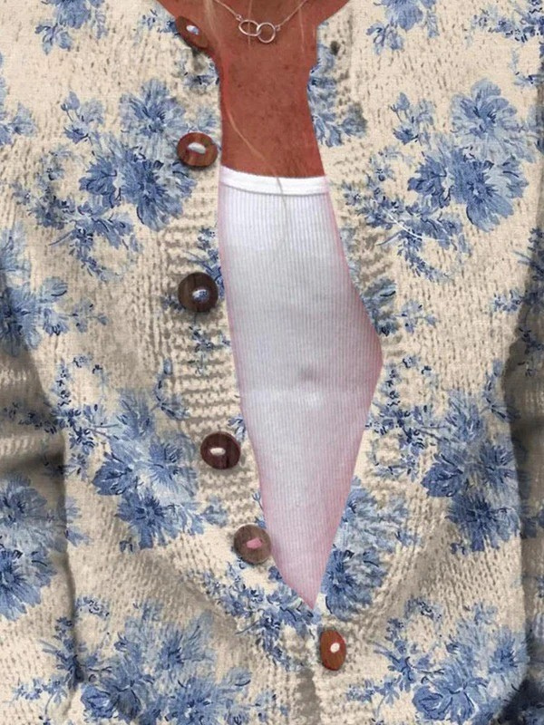 Women's beige cardigan with blue floral pattern and brown buttons