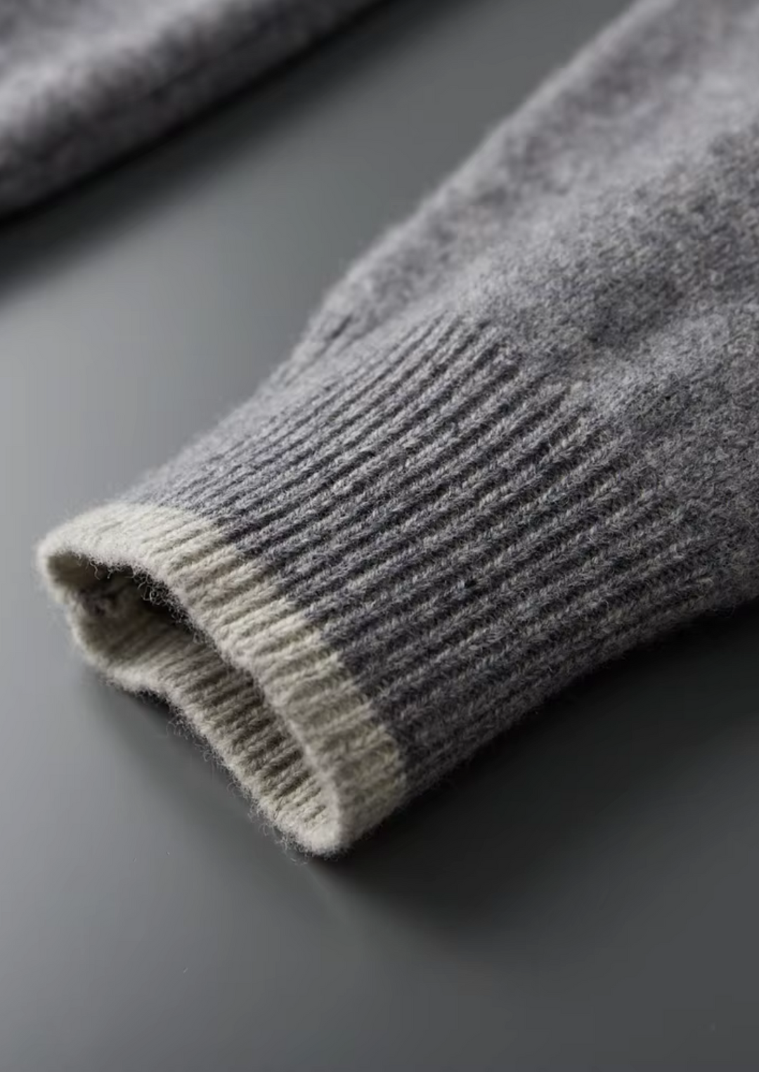 Men's two-tone grey knit tracksuit set with a zip jacket and drawstring trousers
