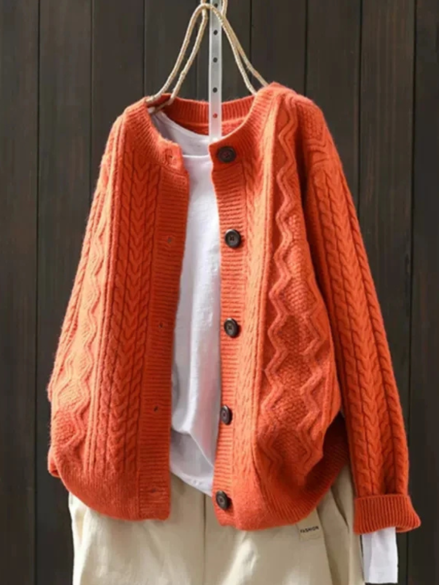 Women's cable-knit cardigan with crew neckline, long sleeves and button front