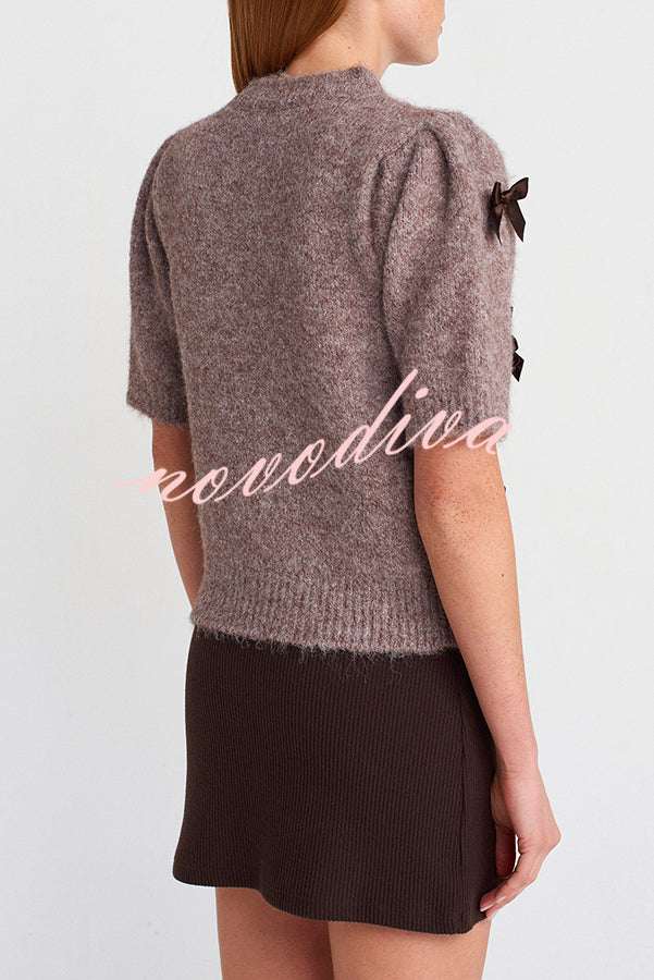 Women's brown knit crop top with dark bow details and short sleeves