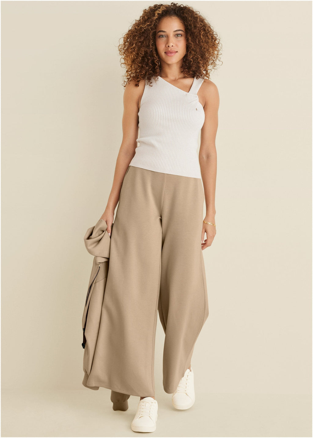 Women's white ribbed sweater tank top with asymmetric twist neckline
