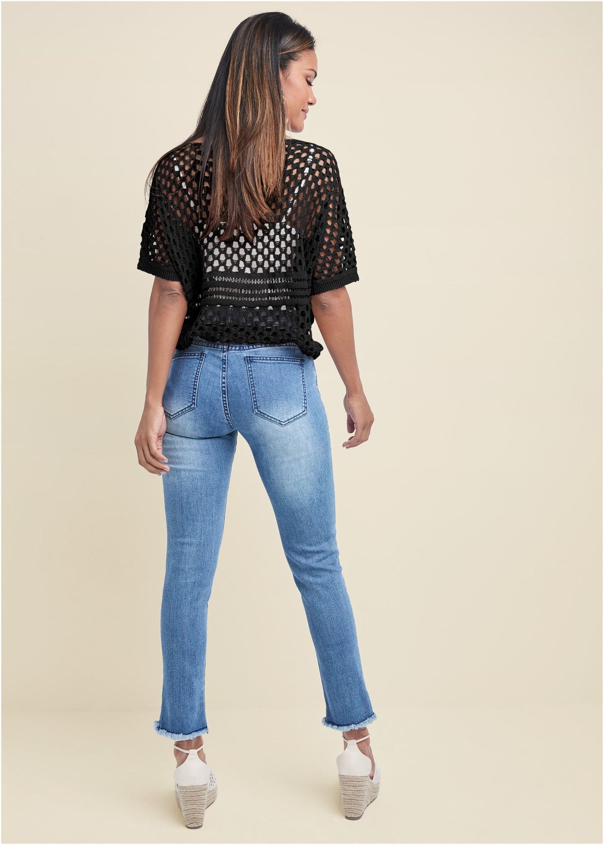 Women's black open-knit sweater with short sleeves, round neckline and tassel waist tie