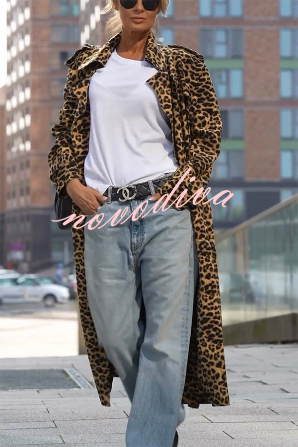 Woman wearing a leopard print long sleeve midi trench coat