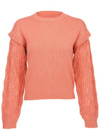 Women's coral crew neck sweater with pointelle sleeves