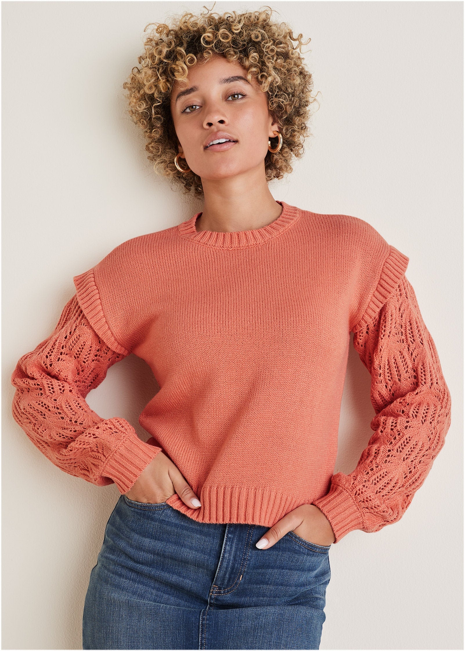 Women's coral crew neck sweater with pointelle sleeves