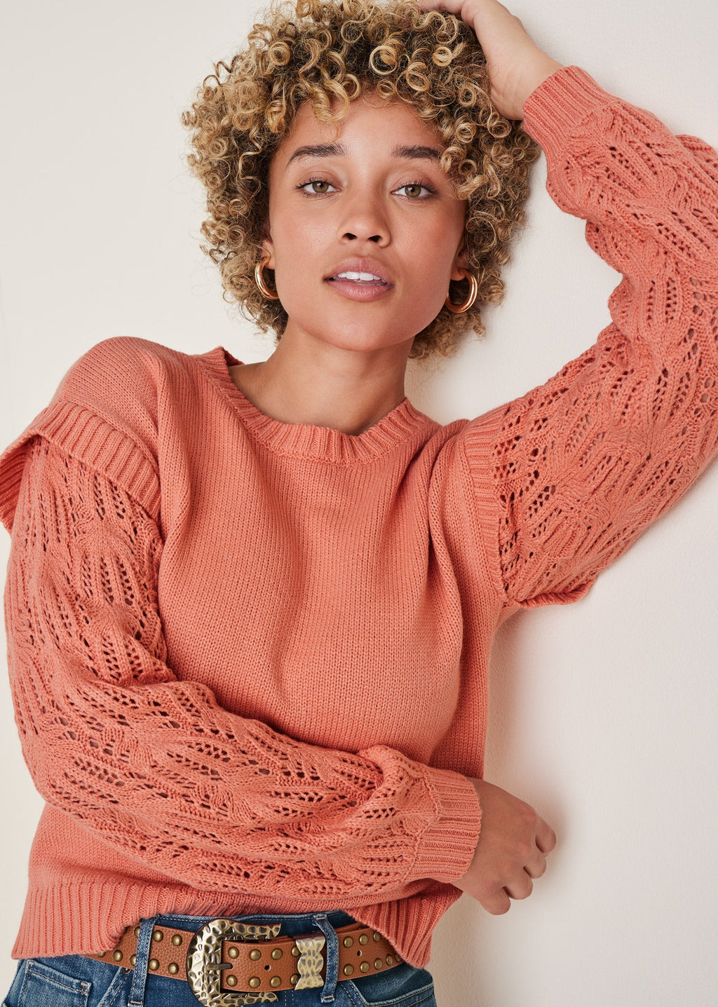 Women's coral crew neck sweater with pointelle sleeves