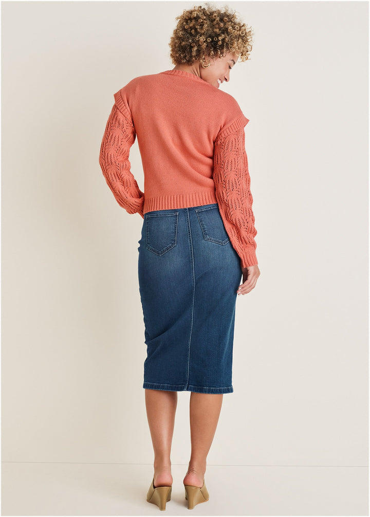 Women's coral crew neck sweater with pointelle sleeves