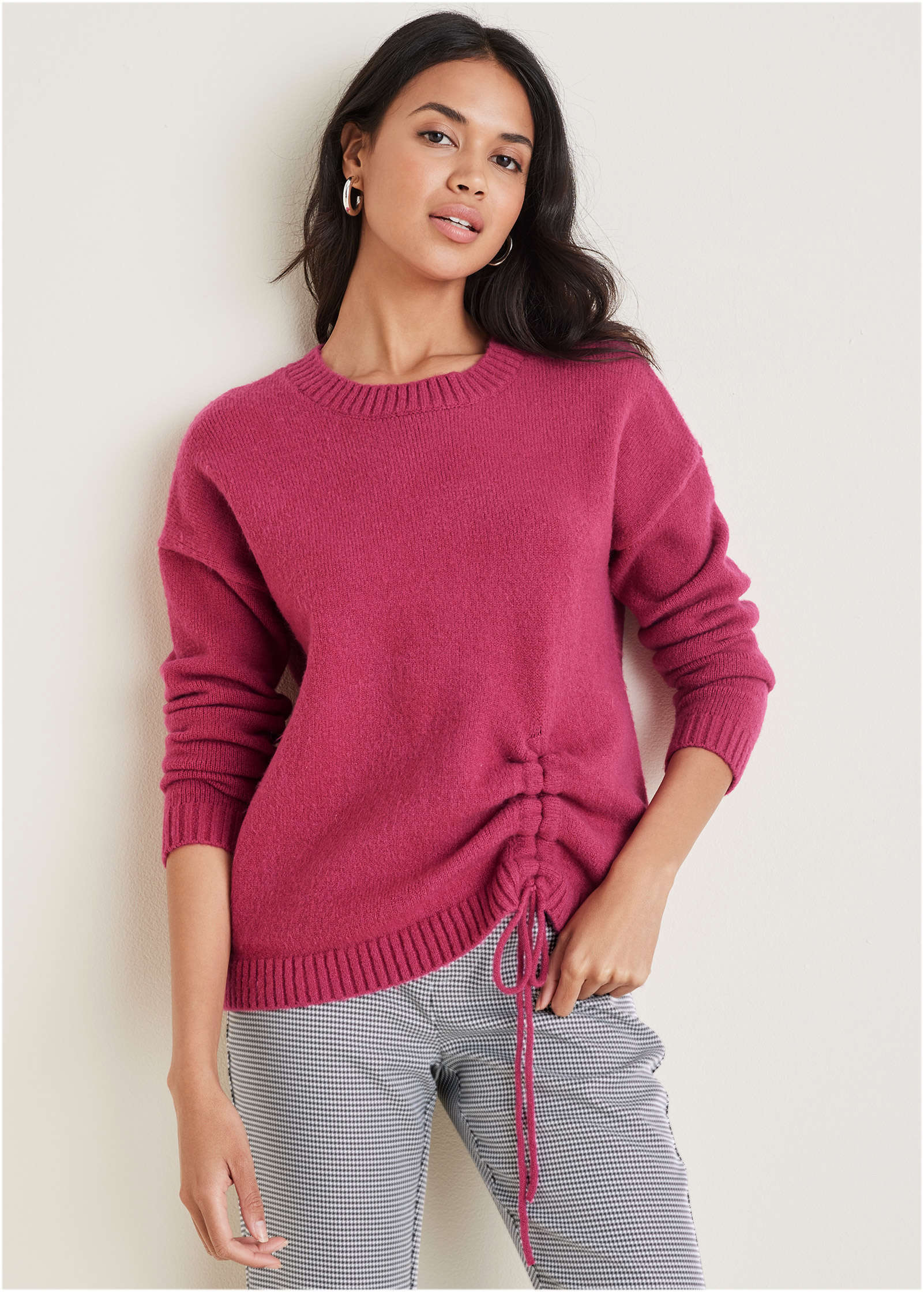 Women's pink knit sweater with crew neck and drawstring hem