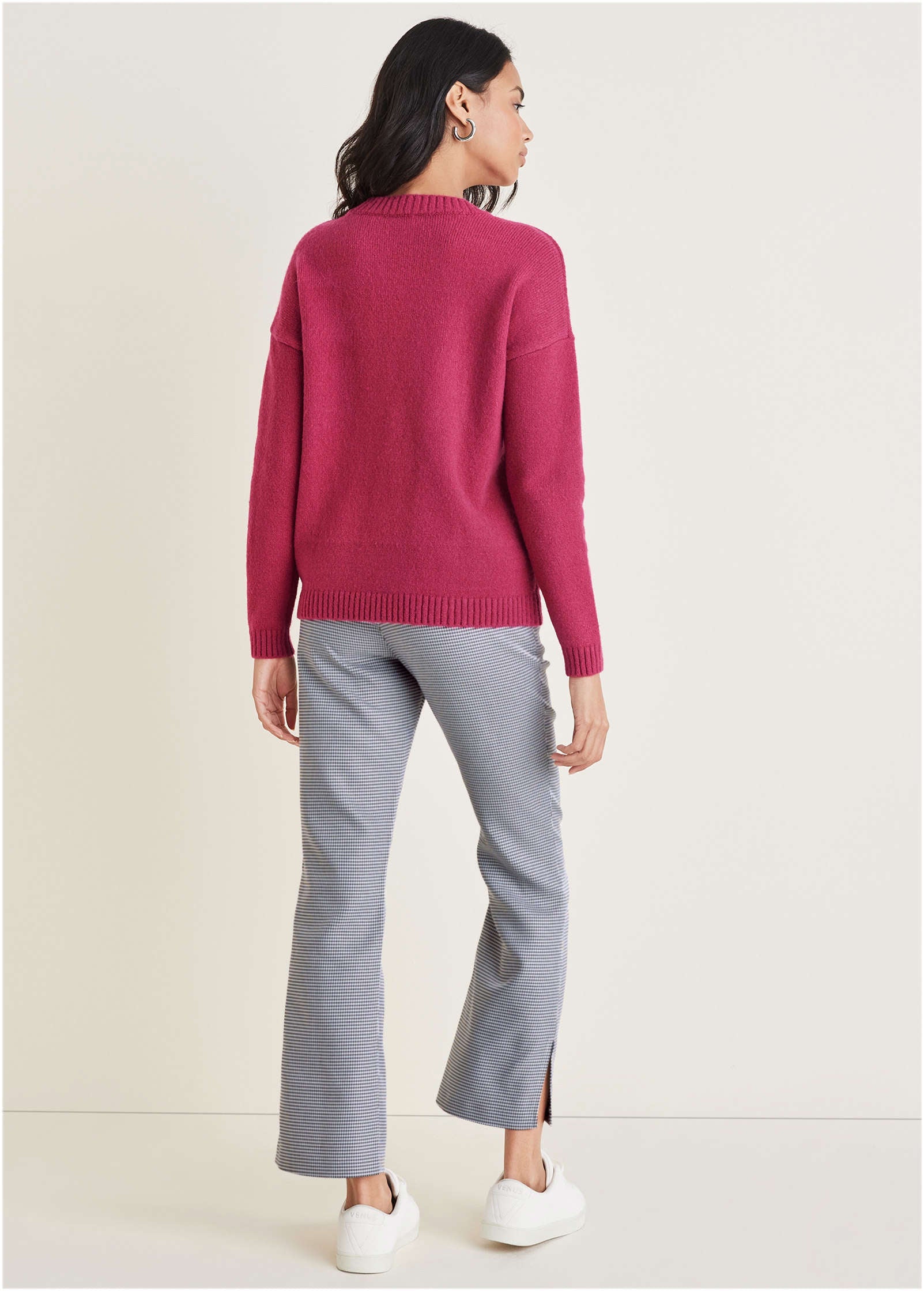 Women's pink knit sweater with crew neck and drawstring hem