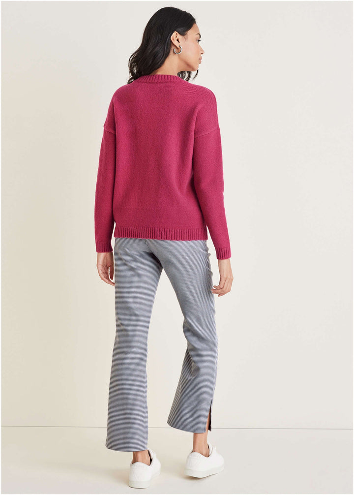 Women's pink knit sweater with crew neck and drawstring hem
