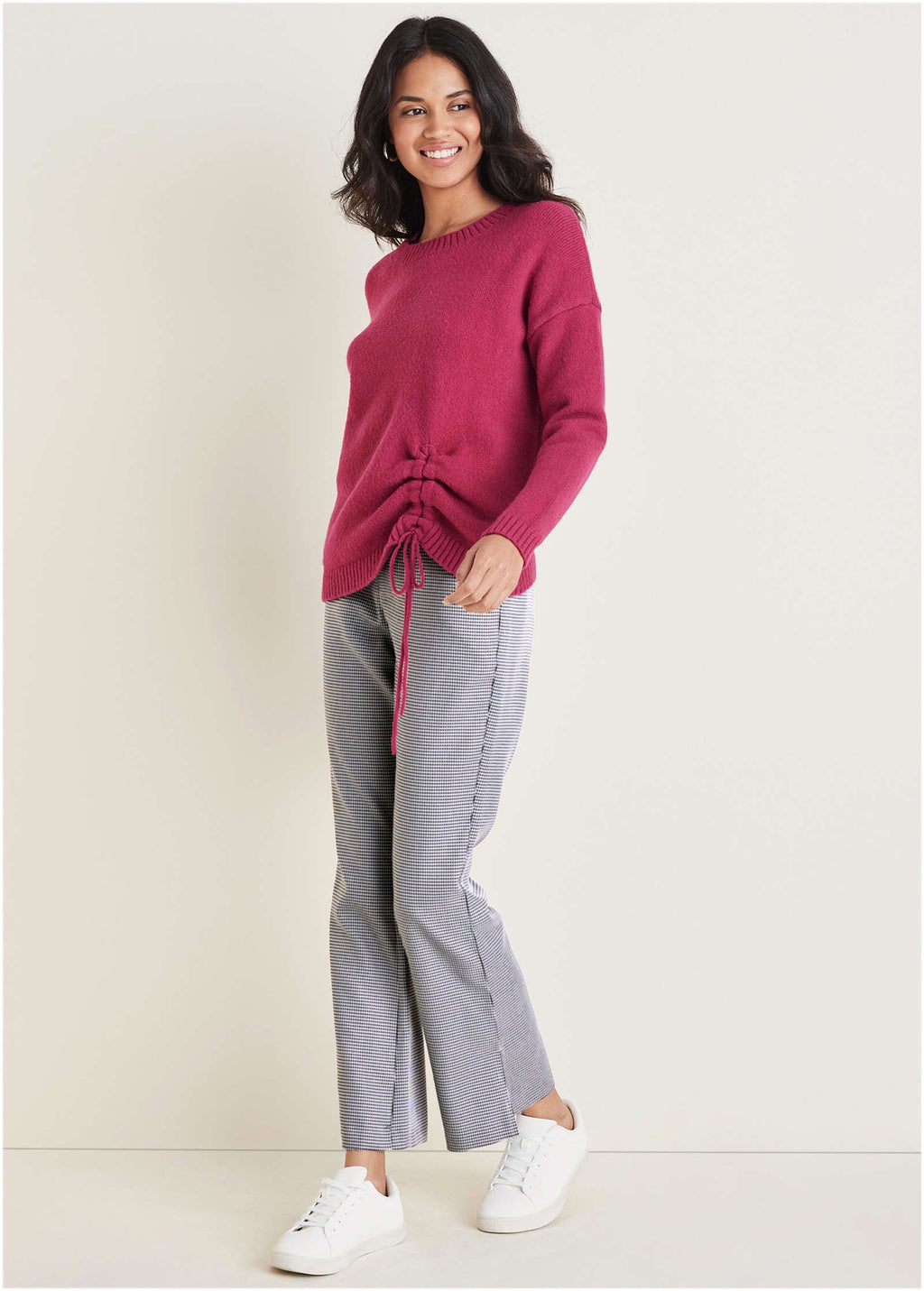 Women's pink knit sweater with crew neck and drawstring hem