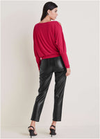 Women's red long sleeve blouse with round neckline and sleeve cutouts