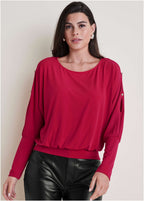 Women's red long sleeve blouse with round neckline and sleeve cutouts