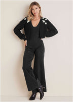 Women's black cropped cardigan with floral appliques and long sleeves