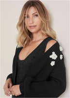 Women's black cropped cardigan with floral appliques and long sleeves