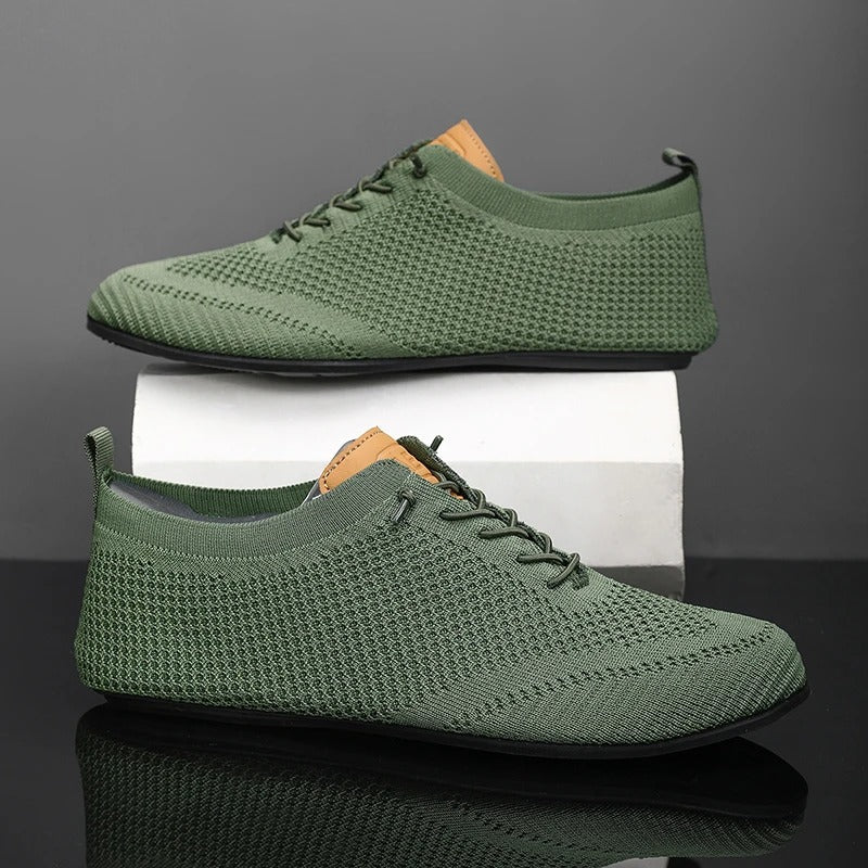Knit sneakers with lace-up fronts, round toes and pull tabs