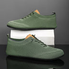 Knit sneakers with lace-up fronts, round toes and pull tabs