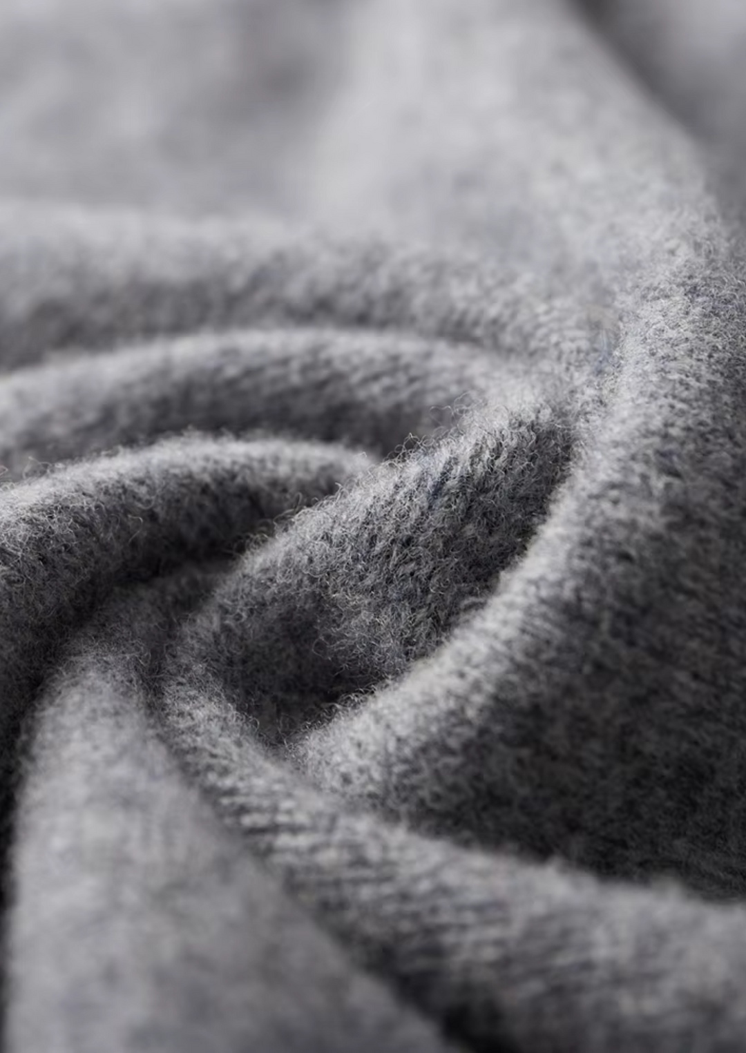 Men's two-tone grey knit tracksuit set with a zip jacket and drawstring trousers