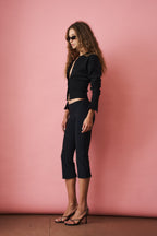 Women's black cropped knit cardigan with buttons and long sleeves