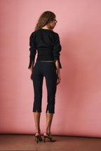 Women's black cropped knit cardigan with buttons and long sleeves