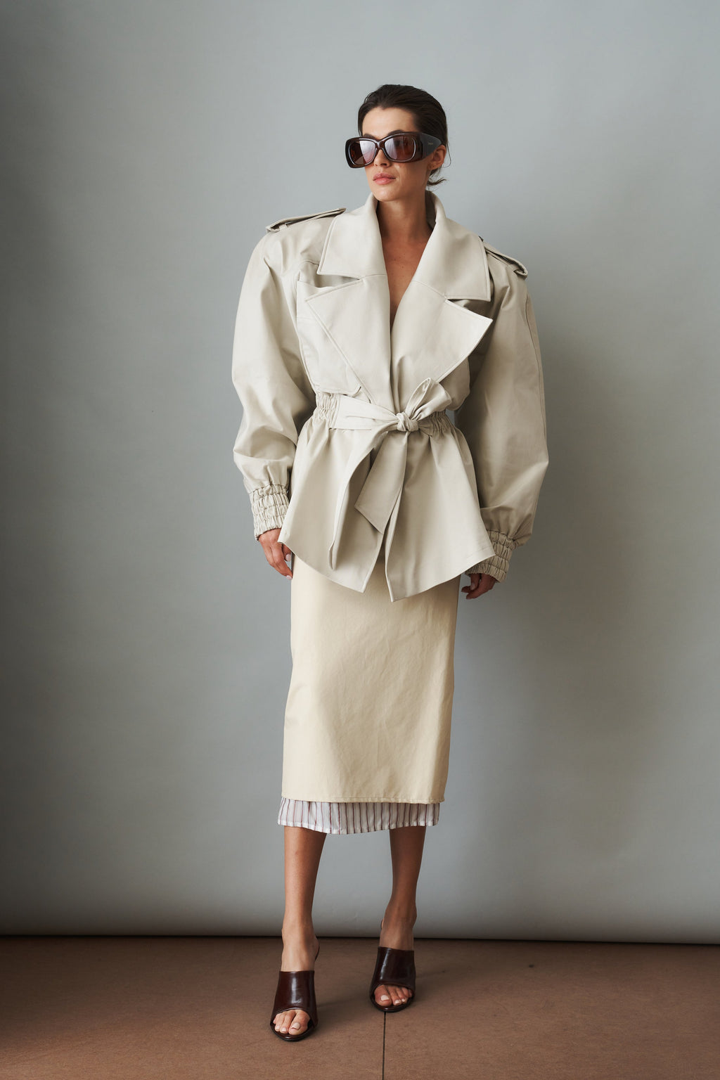 Women's cream belted trench coat with wide lapels