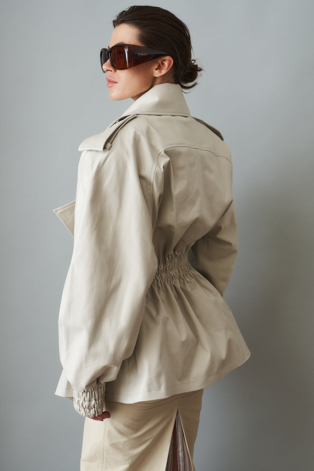 Women's cream belted trench coat with wide lapels