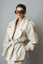 Women's cream belted trench coat with wide lapels