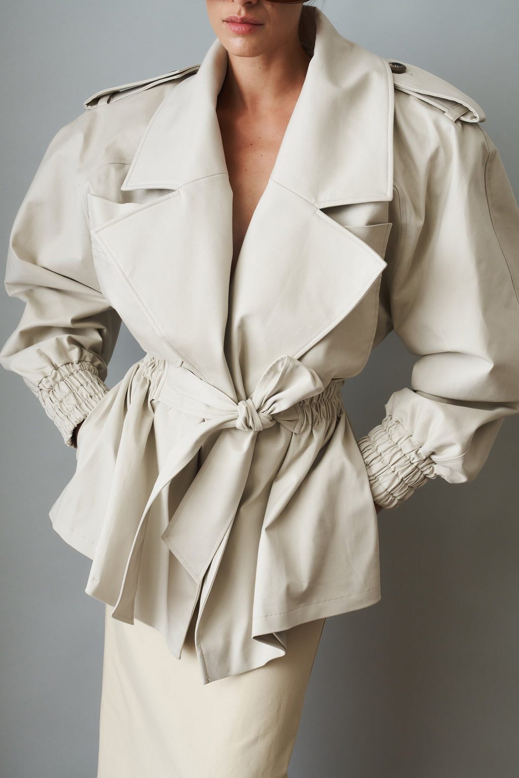 Women's cream belted trench coat with wide lapels