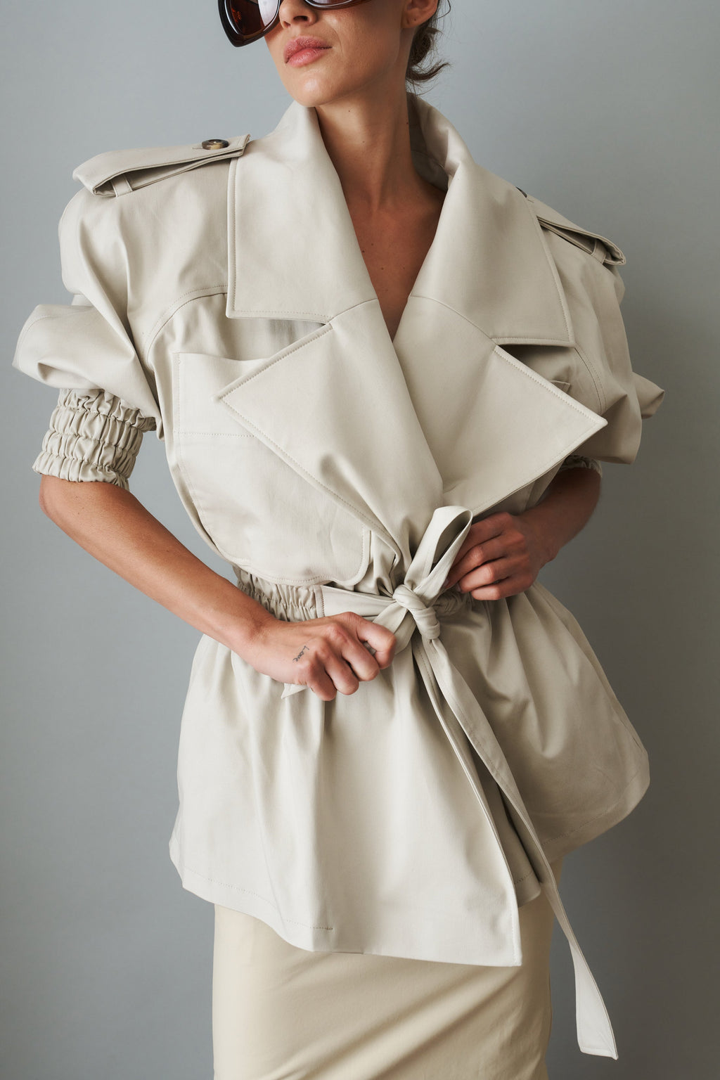 Women's cream belted trench coat with wide lapels