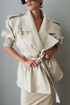 Women's cream belted trench coat with wide lapels