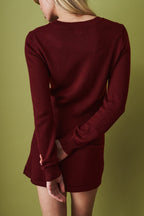 Women's red cropped knit cardigan with round neck and button front