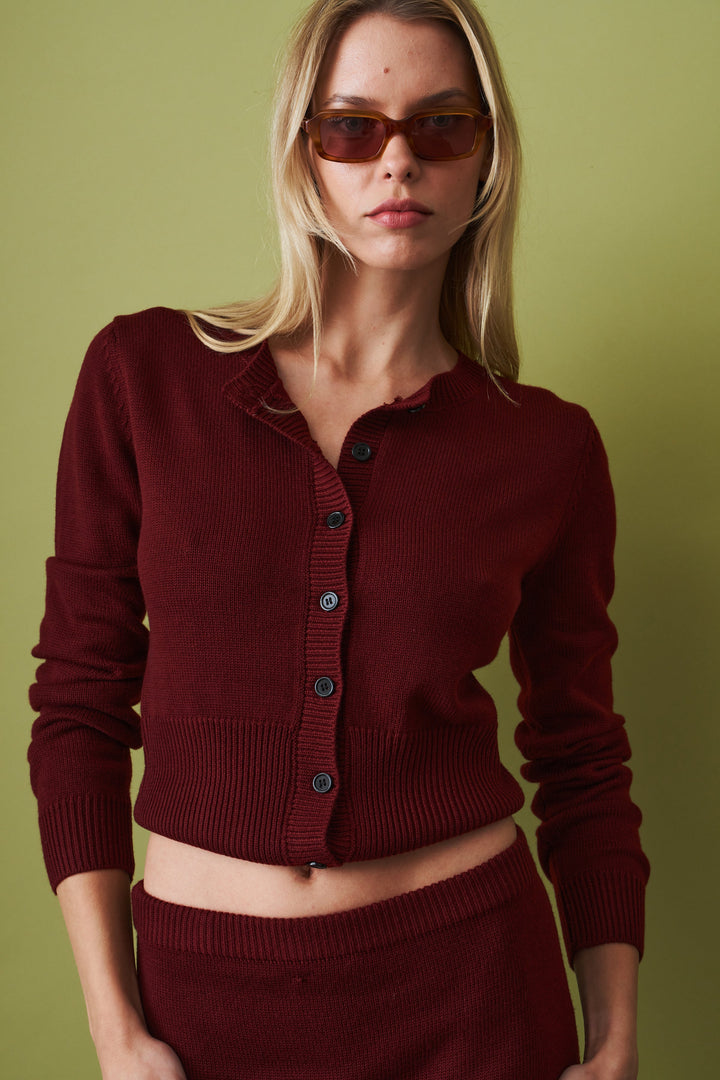 Women's red cropped knit cardigan with round neck and button front